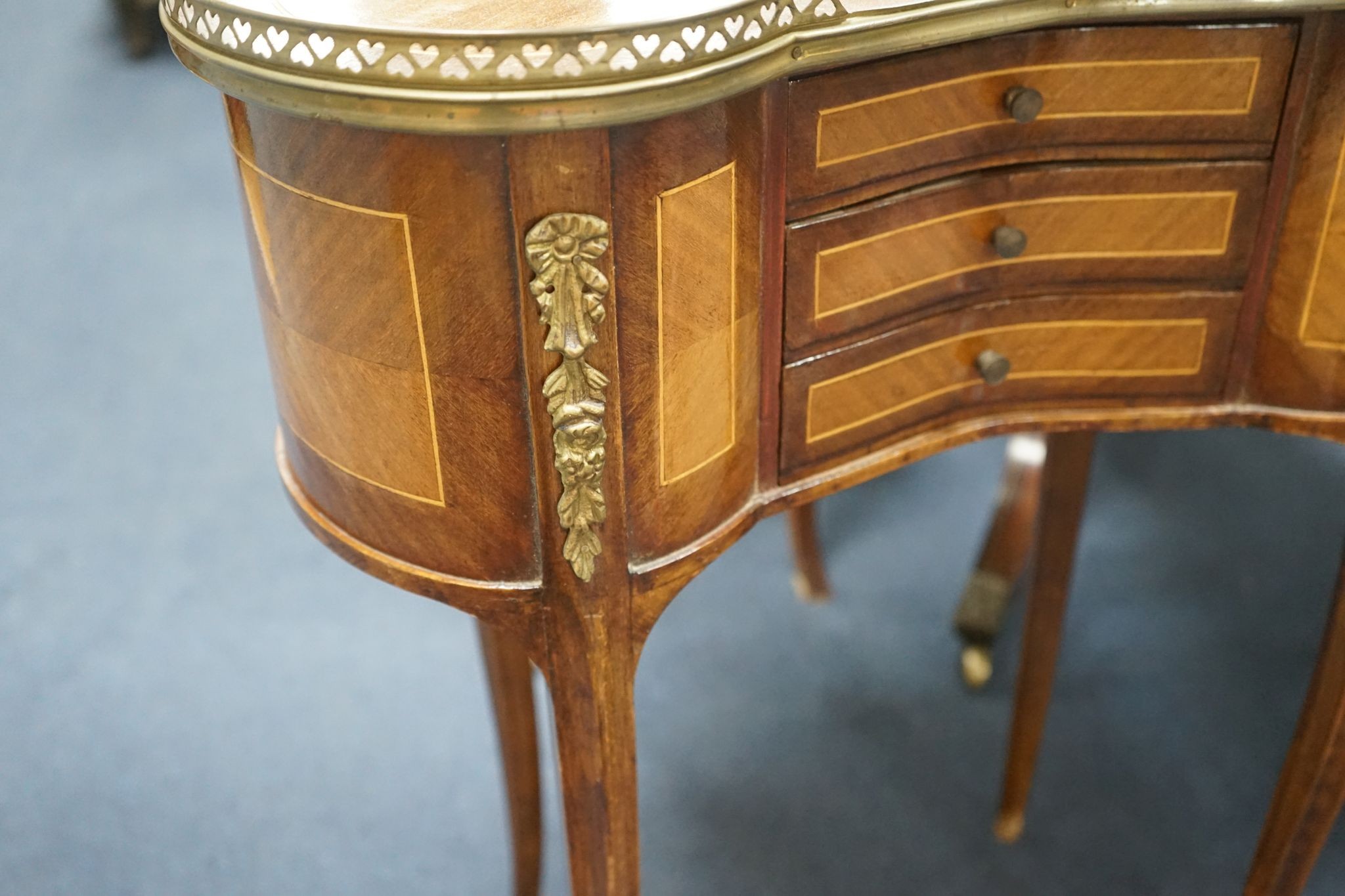 A pair of Louis XV design galleried kidney shaped occasional tables, width 59cm, depth 29cm, height 71cm